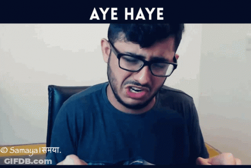 A Man Wearing Glasses And A Black Shirt Is Making A Funny Face And The Words Aye Haye Are Above Him GIF
