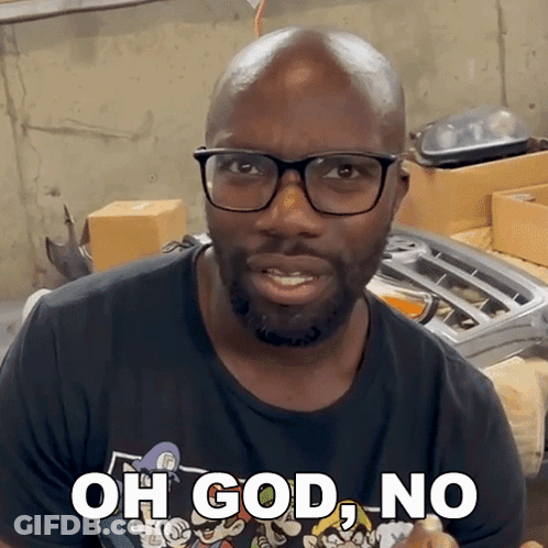 A Man Wearing Glasses And A Black Shirt Says " Oh God No " GIF