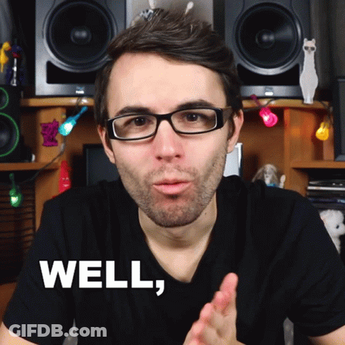 A Man Wearing Glasses And A Black Shirt Says Well In White Letters GIF