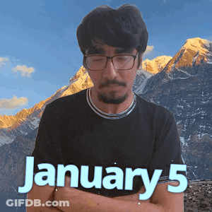 A Man Wearing Glasses And A Black Shirt Stands In Front Of A Mountain And The Date January 5 GIF