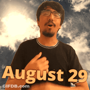 A Man Wearing Glasses And A Black Shirt That Says August 29 On It GIF