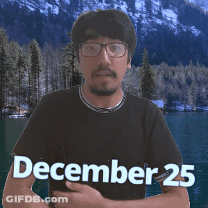 A Man Wearing Glasses And A Black Shirt That Says December 25 On It GIF