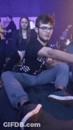 A Man Wearing Glasses And A Black Shirt That Says E On It GIF