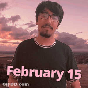 A Man Wearing Glasses And A Black Shirt That Says February 15 On It GIF