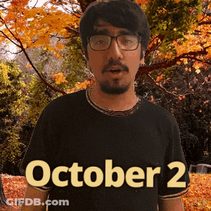 A Man Wearing Glasses And A Black Shirt That Says October 2 On It GIF