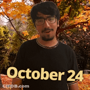 A Man Wearing Glasses And A Black Shirt That Says October 24 On It GIF