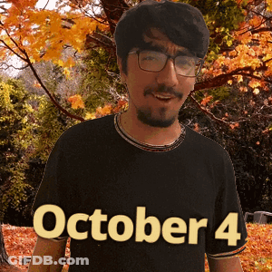 A Man Wearing Glasses And A Black Shirt That Says October 4 On It GIF
