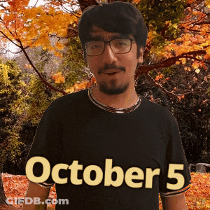 A Man Wearing Glasses And A Black Shirt That Says October 5 On It GIF