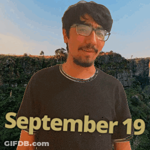 A Man Wearing Glasses And A Black Shirt That Says September 19 On It GIF