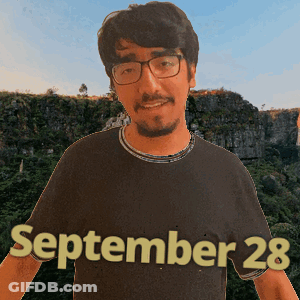 A Man Wearing Glasses And A Black Shirt That Says September 28 On It GIF