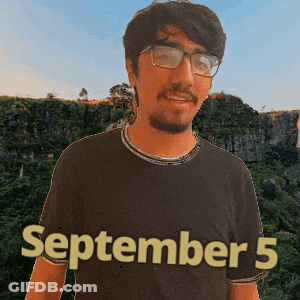 A Man Wearing Glasses And A Black Shirt That Says September 5 On It GIF