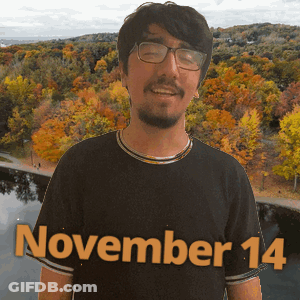 A Man Wearing Glasses And A Black Shirt With November 14 Written On It GIF
