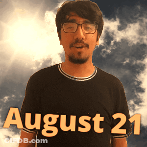 A Man Wearing Glasses And A Black Shirt With The Date August 21 On It GIF