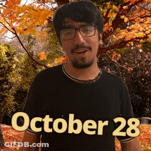 A Man Wearing Glasses And A Black Shirt With The Date October 28 On The Bottom GIF