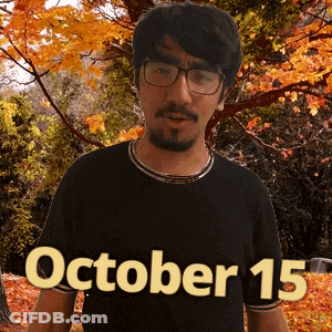 A Man Wearing Glasses And A Black Shirt With The Date Of October 15 GIF