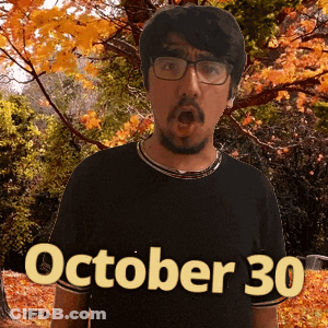 A Man Wearing Glasses And A Black Shirt With The Date Of October 30 GIF