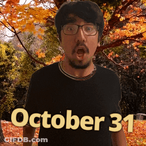 A Man Wearing Glasses And A Black Shirt With The Date Of October 31 On It GIF