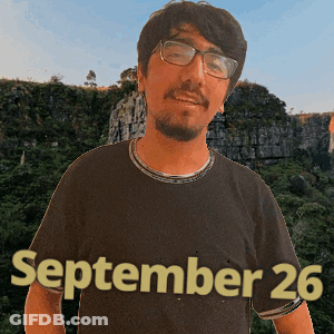 A Man Wearing Glasses And A Black Shirt With The Date September 26 On It GIF