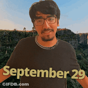A Man Wearing Glasses And A Black Shirt With The Date September 29 On It GIF