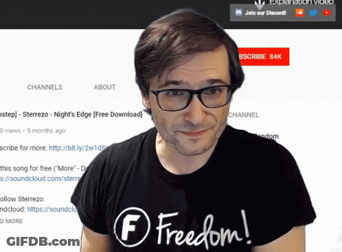A Man Wearing Glasses And A Black Shirt With The Word Freedom On It GIF