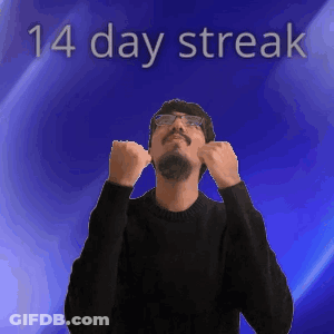 A Man Wearing Glasses And A Black Sweater Stands In Front Of A Blue Background With The Words 14 Day Streak Above Him GIF