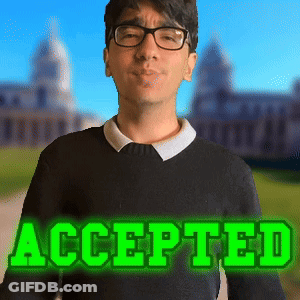 A Man Wearing Glasses And A Black Sweater With The Word Accepted In Green Letters GIF