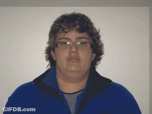 A Man Wearing Glasses And A Blue Jacket That Says Patagonia On It GIF
