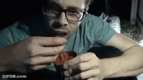 Man In Glasses And Blue Shirt Eating Food Cup GIF