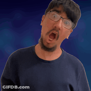 A Man Wearing Glasses And A Blue Shirt Is Making A Funny Face GIF