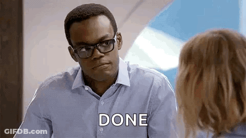 A Man Wearing Glasses And A Blue Shirt Is Talking To A Woman And Saying `` Done '' . GIF