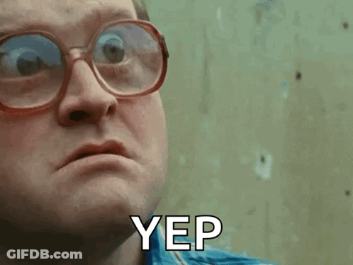 A Man Wearing Glasses And A Blue Shirt Says Yep On His Face GIF