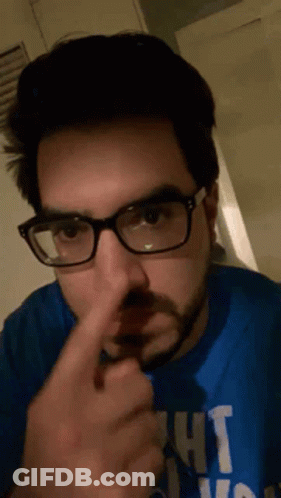 A Man Wearing Glasses And A Blue Shirt That Says Ight GIF