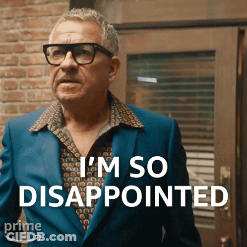 A Man Wearing Glasses And A Blue Suit Says " I 'M So Disappointed " GIF