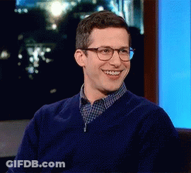 Man In Blue Sweater Smiling At Screen GIF