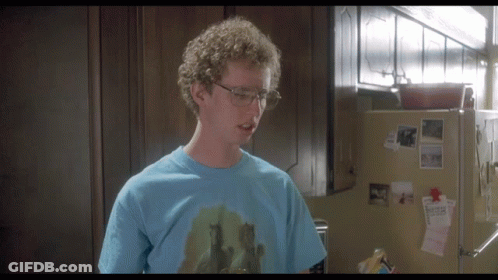 A Man Wearing Glasses And A Blue T-Shirt With A Picture Of Horses On It GIF
