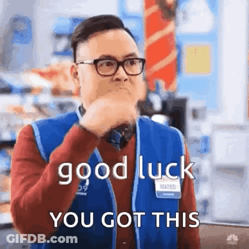 A Man Wearing Glasses And A Blue Vest Is Holding His Hand To His Mouth And Saying `` Good Luck You Got This '' . GIF