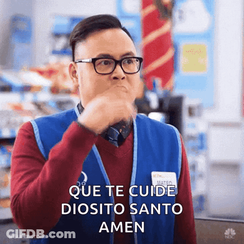 A Man Wearing Glasses And A Blue Vest Says Que Te Cuide Diosito Santo Amen In Spanish GIF