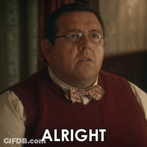 A Man Wearing Glasses And A Bow Tie Has The Word Alright Above His Head GIF