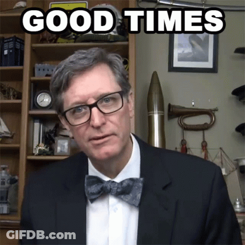 A Man Wearing Glasses And A Bow Tie Has The Words Good Times Above Him GIF