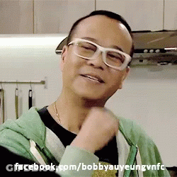 A Man Wearing Glasses And A Green Hoodie With Facebook.com/bobbyauyeungvnfc Written Below Him GIF