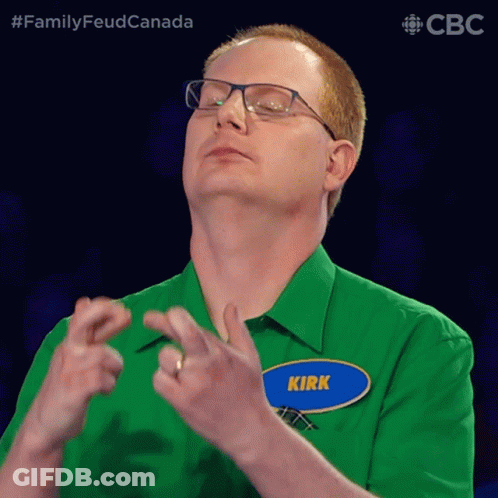 A Man Wearing Glasses And A Green Shirt Has A Name Tag That Says Kirk GIF