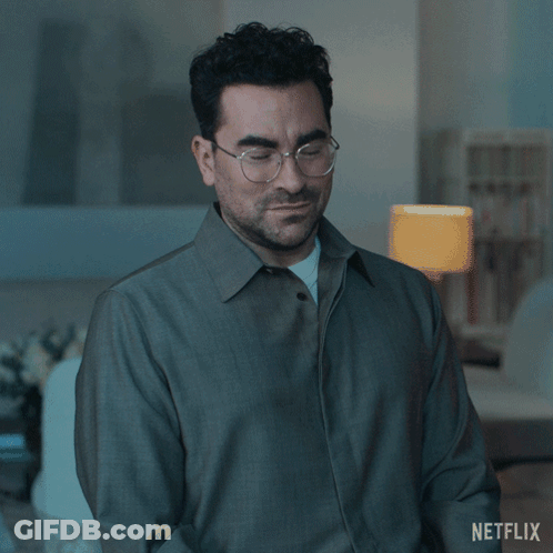 A Man Wearing Glasses And A Grey Jacket Says Of Course GIF