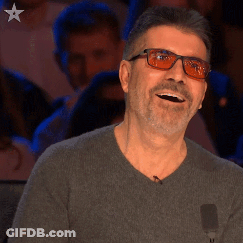 Man With Glasses And Grey Sweater Laughing GIF