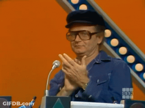 A Man Wearing Glasses And A Hat Is Giving A Thumbs Up Sign GIF