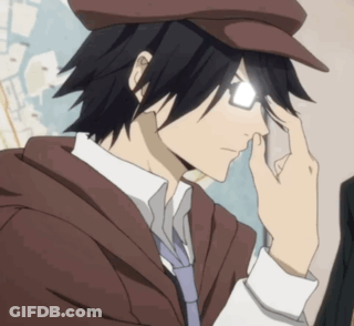 A Man Wearing Glasses And A Hat Is Holding His Hand To His Forehead GIF