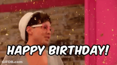 A Man Wearing Glasses And A Hat Is Saying `` Happy Birthday '' . GIF