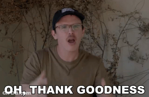 A Man Wearing Glasses And A Hat Is Saying Oh Thank Goodness GIF