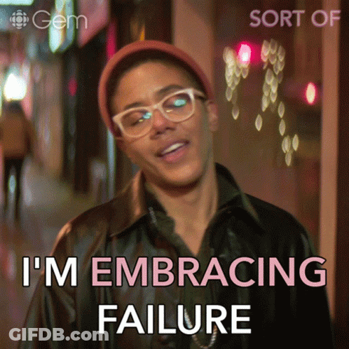 A Man Wearing Glasses And A Hat Says " I 'M Embracing Failure " In Pink Letters GIF