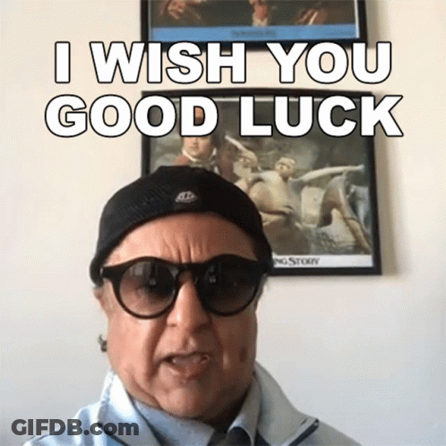 A Man Wearing Glasses And A Hat Says I Wish You Good Luck GIF