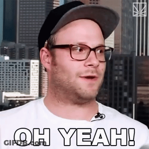A Man Wearing Glasses And A Hat With The Words Oh Yeah On His Shirt GIF